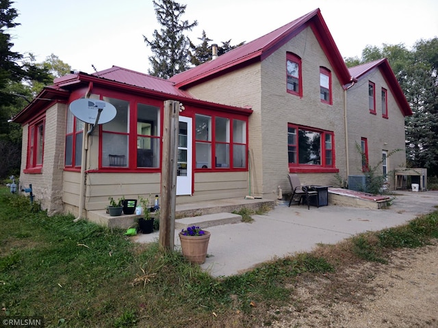 back of property featuring a patio area