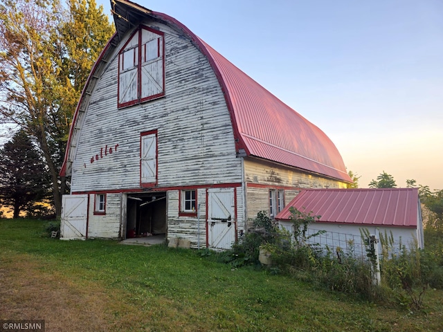 exterior space with a yard and an outbuilding