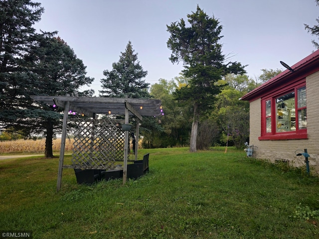 view of yard with a pergola