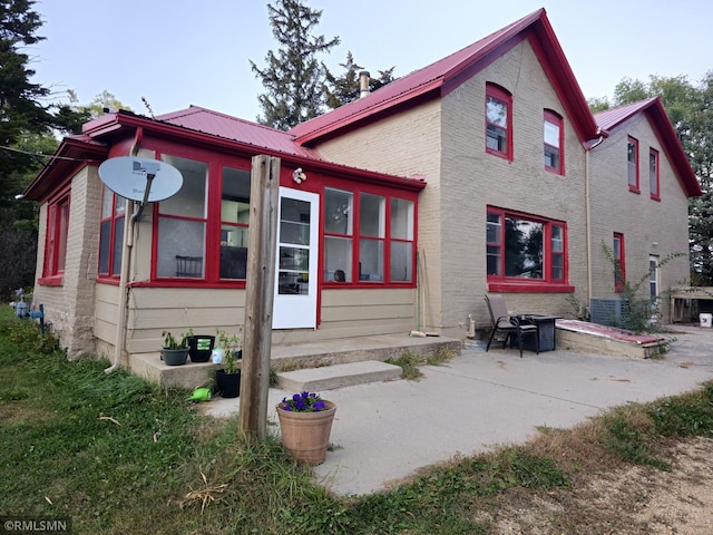 back of property with a patio area