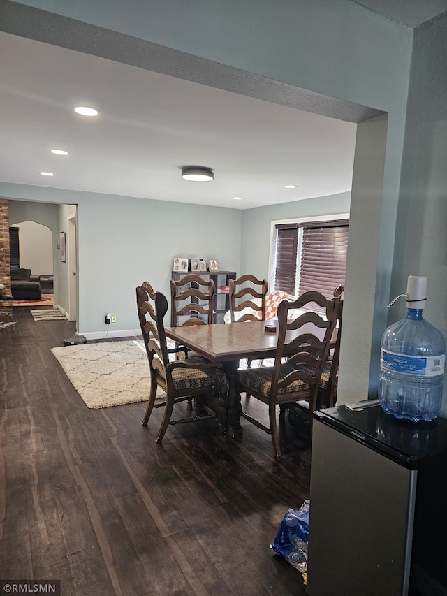 dining area with dark hardwood / wood-style floors