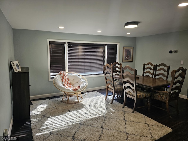 dining space with dark wood-type flooring