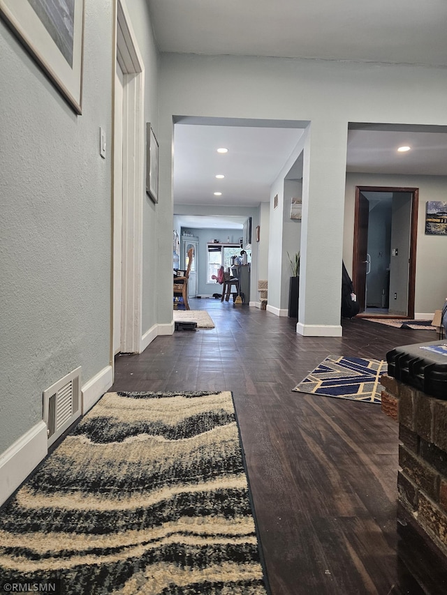 hall with dark hardwood / wood-style floors