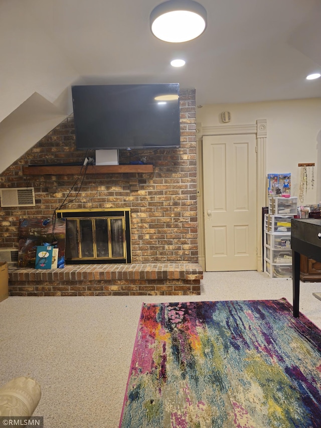 carpeted living room with a fireplace