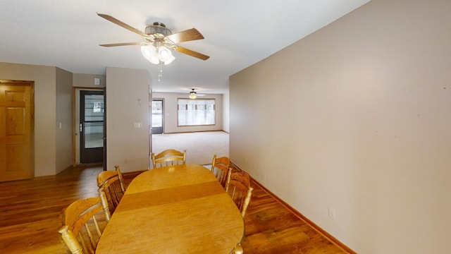 dining room featuring ceiling fan and wood-type flooring