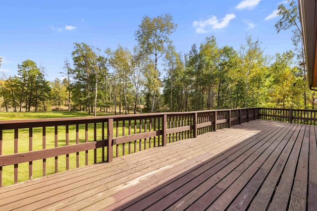 wooden terrace featuring a yard