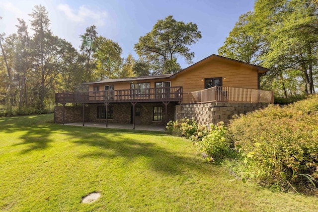 back of house with a deck and a lawn