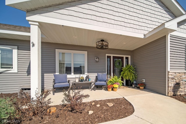 doorway to property featuring an outdoor hangout area and a patio area