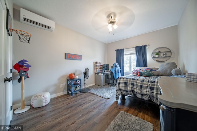 bedroom with dark wood-type flooring, ceiling fan, and a wall mounted air conditioner