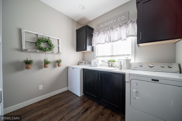 washroom with dark hardwood / wood-style floors, separate washer and dryer, cabinets, and sink