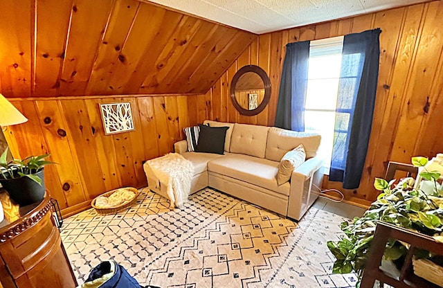 living room featuring wooden walls and vaulted ceiling