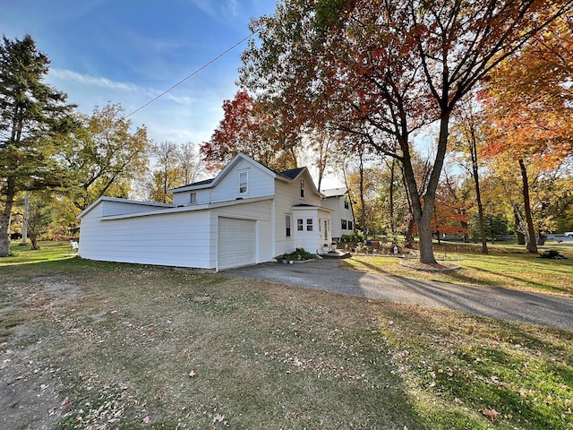 view of side of home featuring a lawn