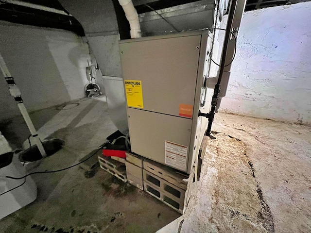 utility room featuring heating unit