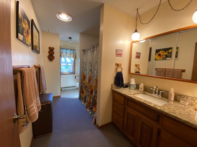 bathroom featuring vanity, baseboard heating, and a shower with shower curtain