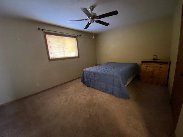 bedroom featuring light colored carpet and ceiling fan