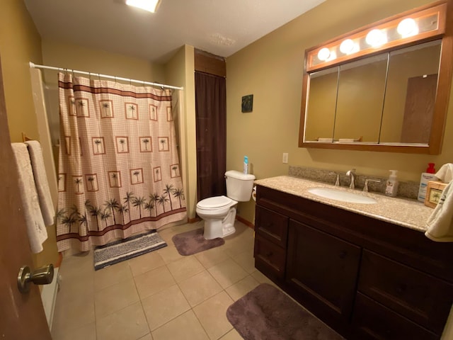 bathroom with toilet, walk in shower, vanity, and tile patterned floors