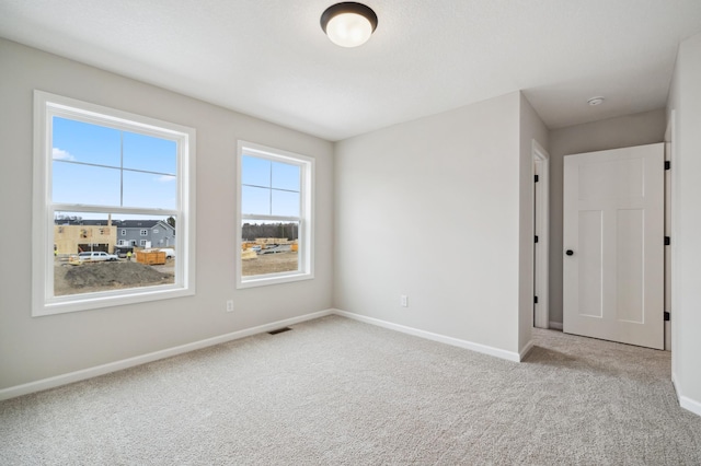 view of carpeted spare room