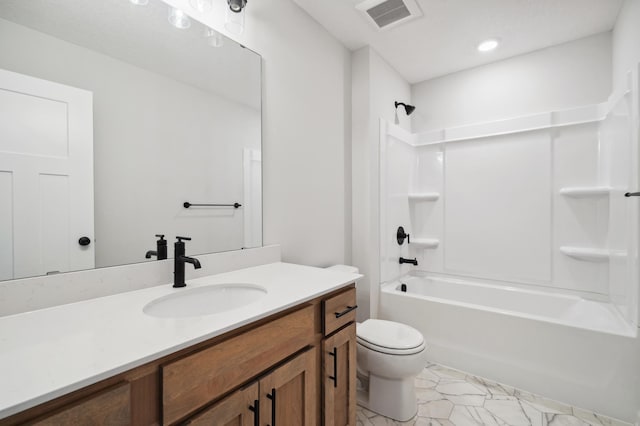 full bathroom with vanity, toilet, and  shower combination