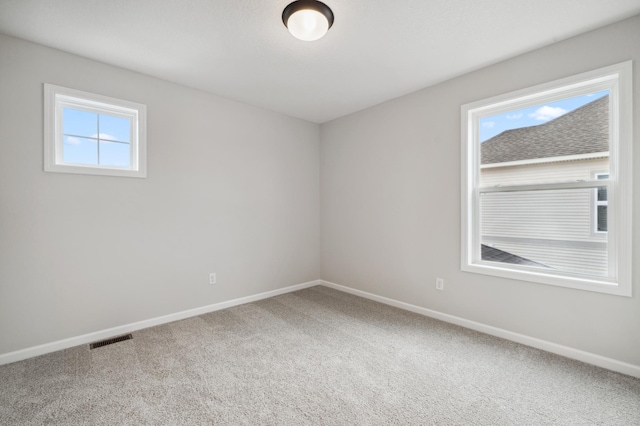 spare room featuring carpet floors