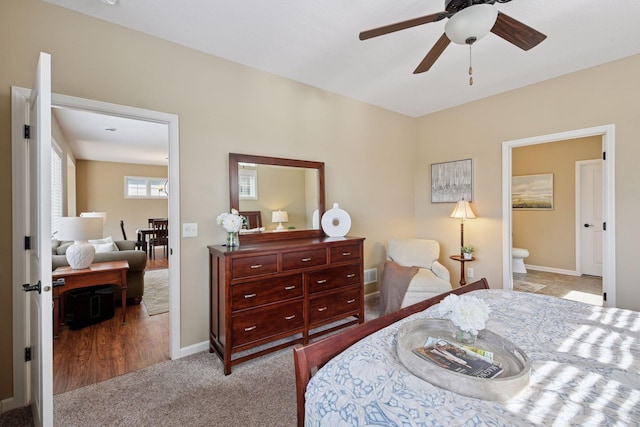 carpeted bedroom featuring baseboards