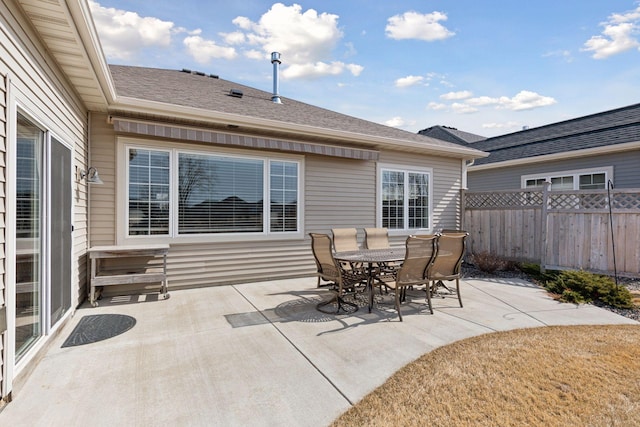 view of patio featuring fence