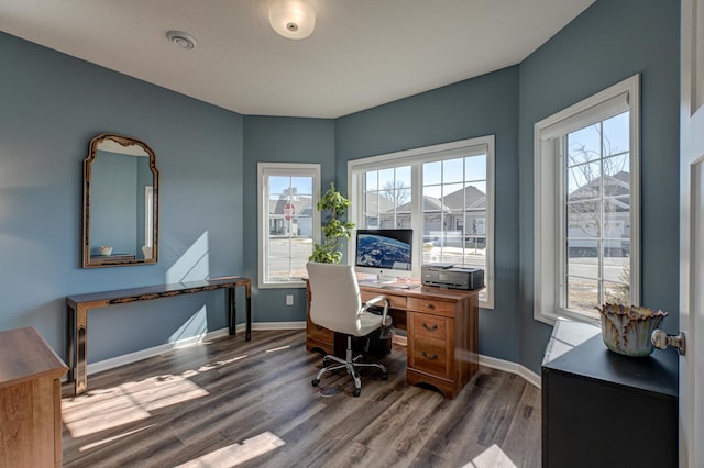 office area with dark wood-type flooring and baseboards