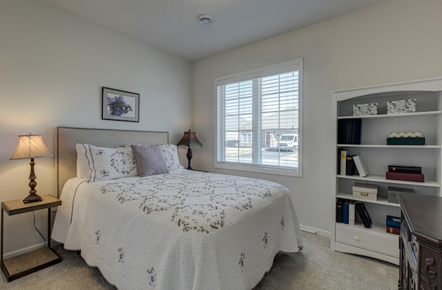 carpeted bedroom with baseboards