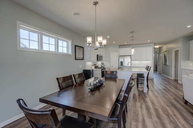 dining space featuring baseboards, dark wood-style flooring, and recessed lighting