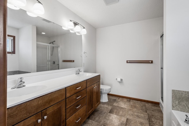 full bathroom with vanity, toilet, plus walk in shower, and a textured ceiling