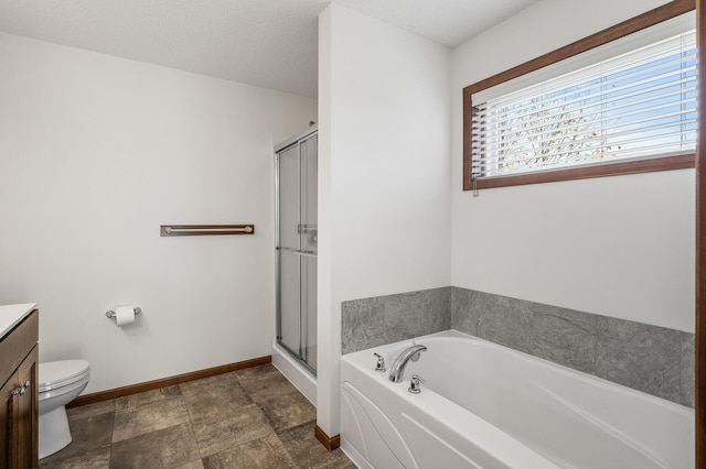 full bathroom featuring toilet, plus walk in shower, vanity, and a textured ceiling