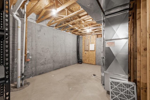 basement with electric panel and heating unit