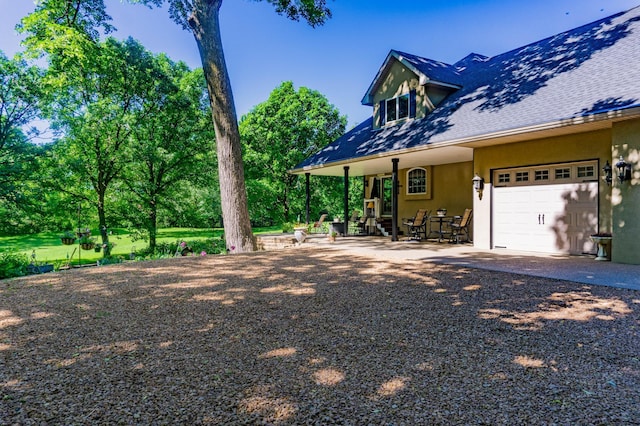 exterior space featuring a patio area and a garage