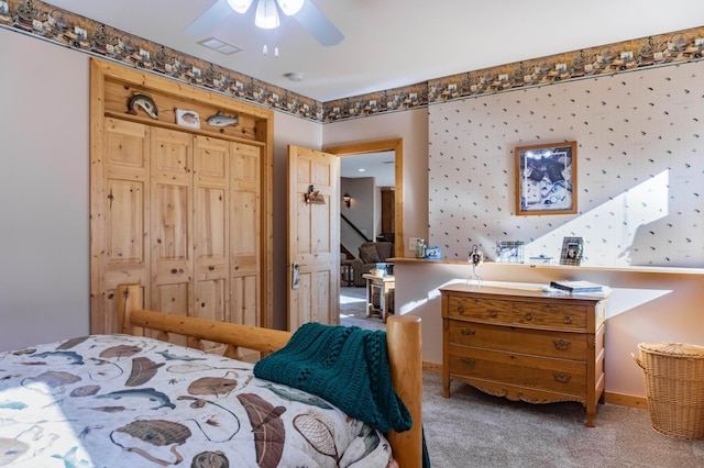 bedroom featuring a closet, carpet, and ceiling fan