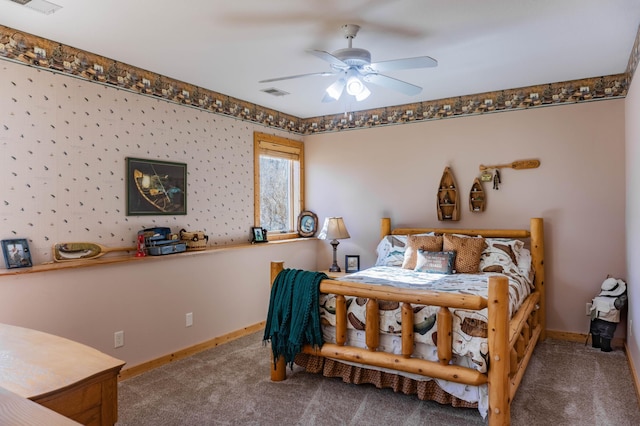 bedroom featuring ceiling fan and carpet