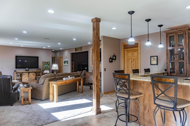 interior space featuring a barn door and light carpet