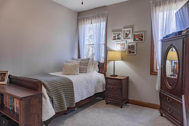 bedroom with light colored carpet