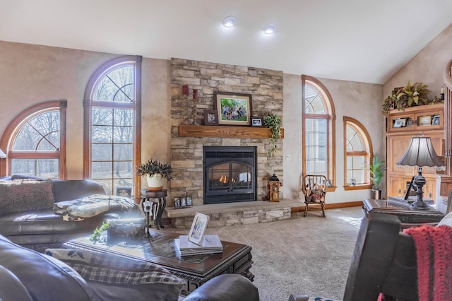 carpeted living room featuring a fireplace and vaulted ceiling