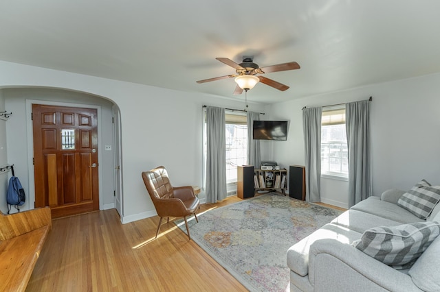 living room with ceiling fan, hardwood / wood-style flooring, and plenty of natural light