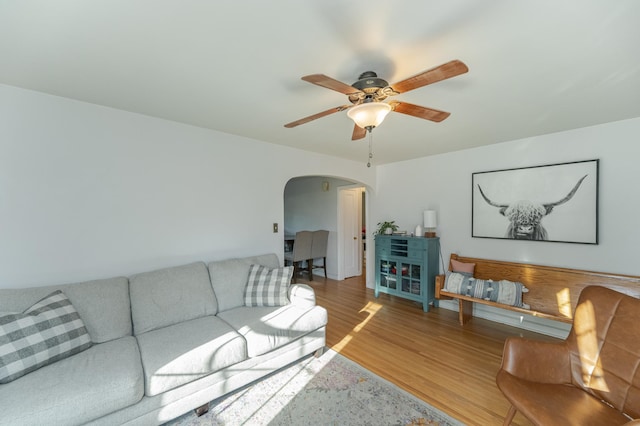 living room featuring ceiling fan and hardwood / wood-style floors