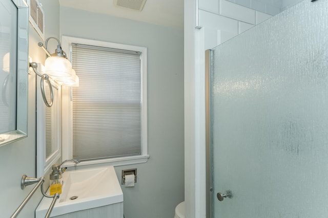 bathroom with toilet and vanity