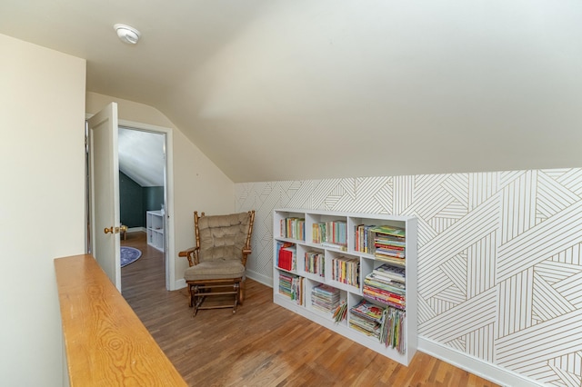 sitting room featuring hardwood / wood-style floors and vaulted ceiling