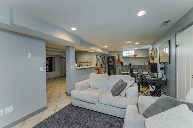 living room with light tile patterned floors