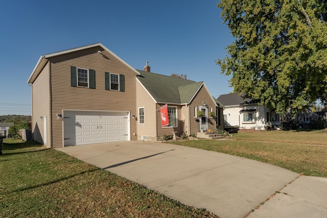 view of front of house with a garage and a front lawn