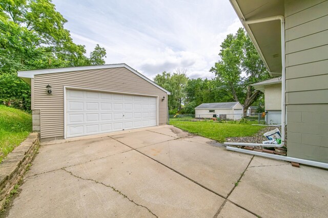 garage with a yard