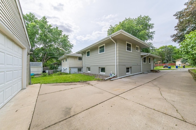 exterior space with a yard and a garage