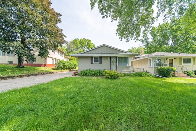 ranch-style home with a front yard