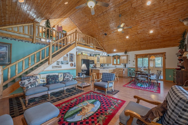 living room featuring light hardwood / wood-style floors, wood ceiling, high vaulted ceiling, and ceiling fan