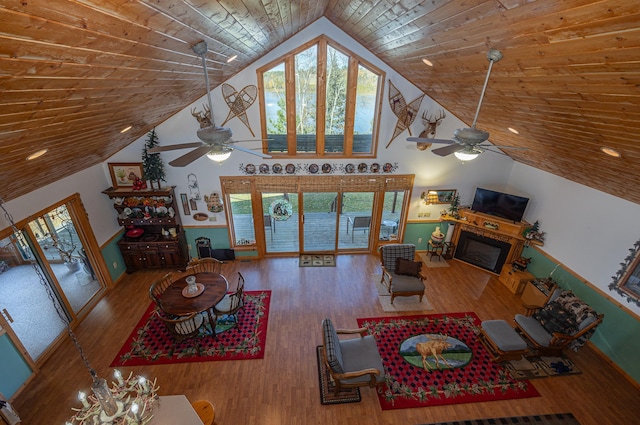 living room featuring ceiling fan, lofted ceiling, hardwood / wood-style floors, and wood ceiling