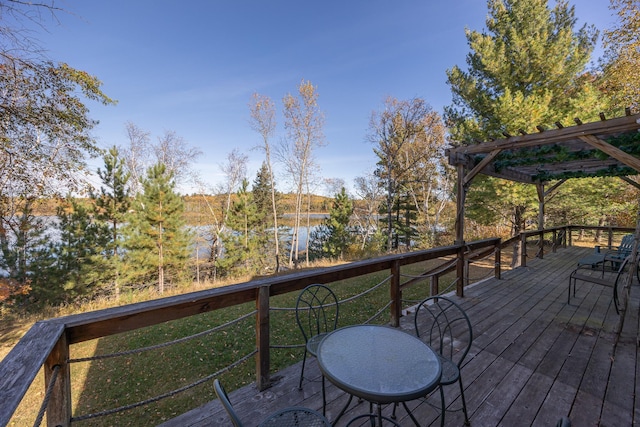 wooden terrace featuring a pergola and a water view