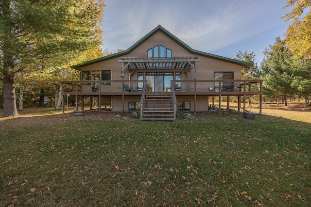 back of property featuring a deck and a yard